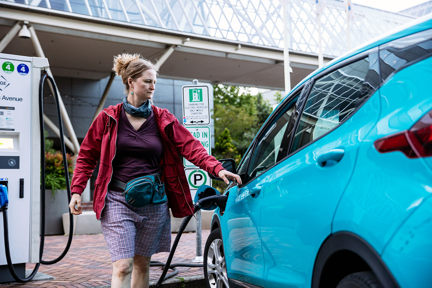 Person charging their EV