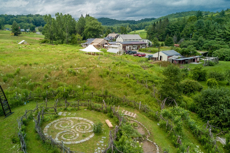Aerial view of theater campus in lush, green field