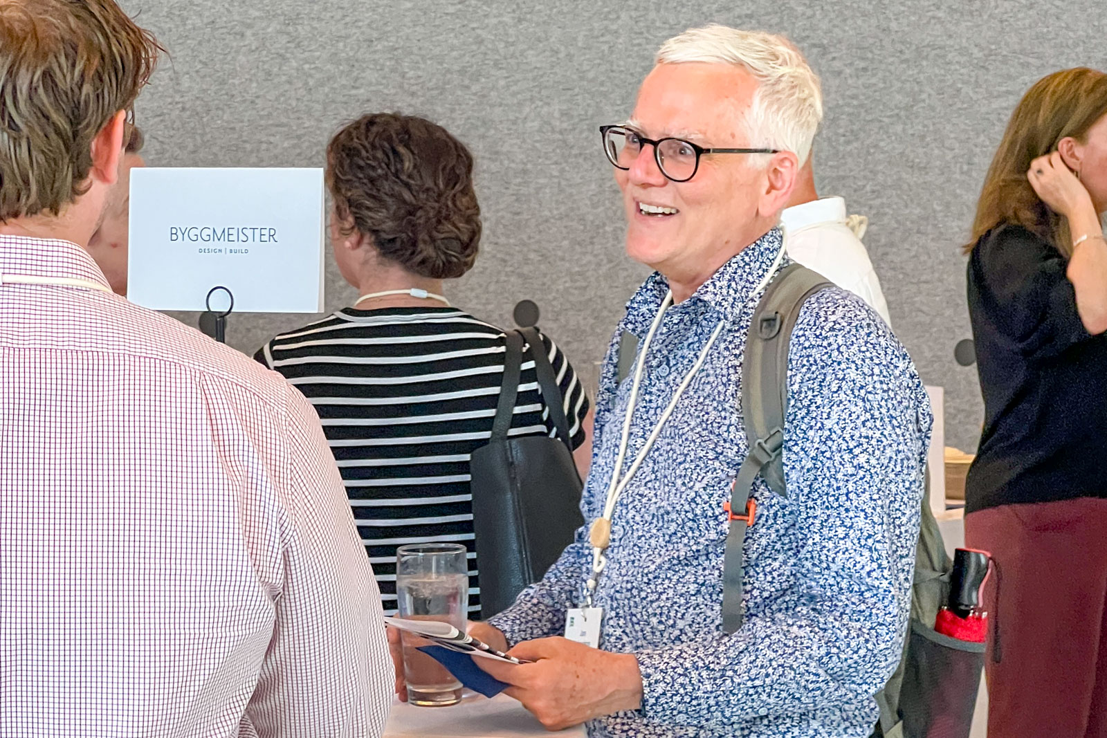 People conversing at a conference