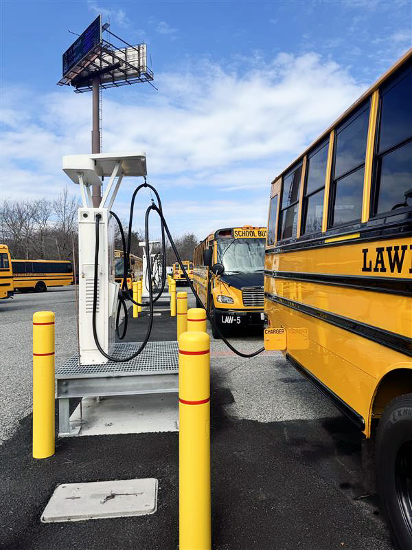 Lawrence electric school buses at charging station