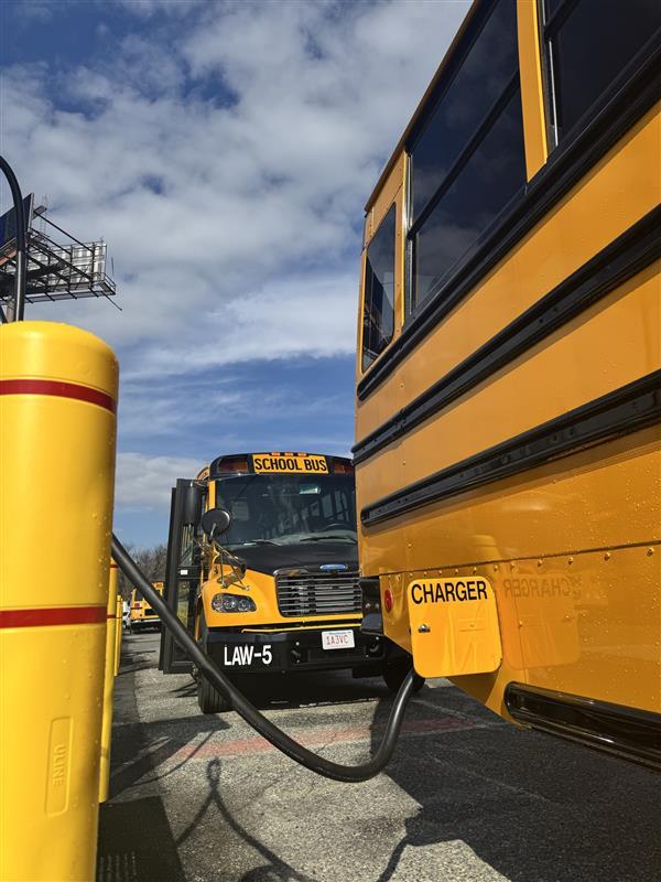Electric school bus from the Lawrence Public Schools recharges