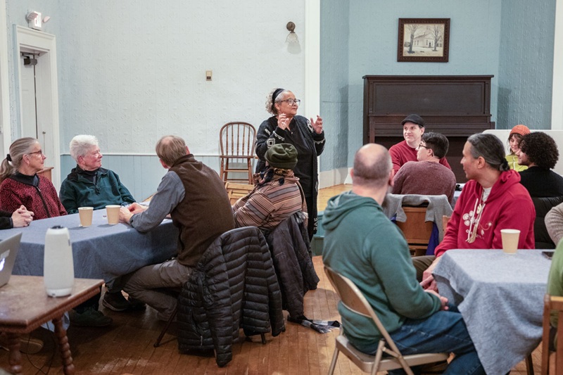 People listening to a speaker in an informal community room