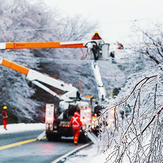 Utility truck doing work on icy winter day