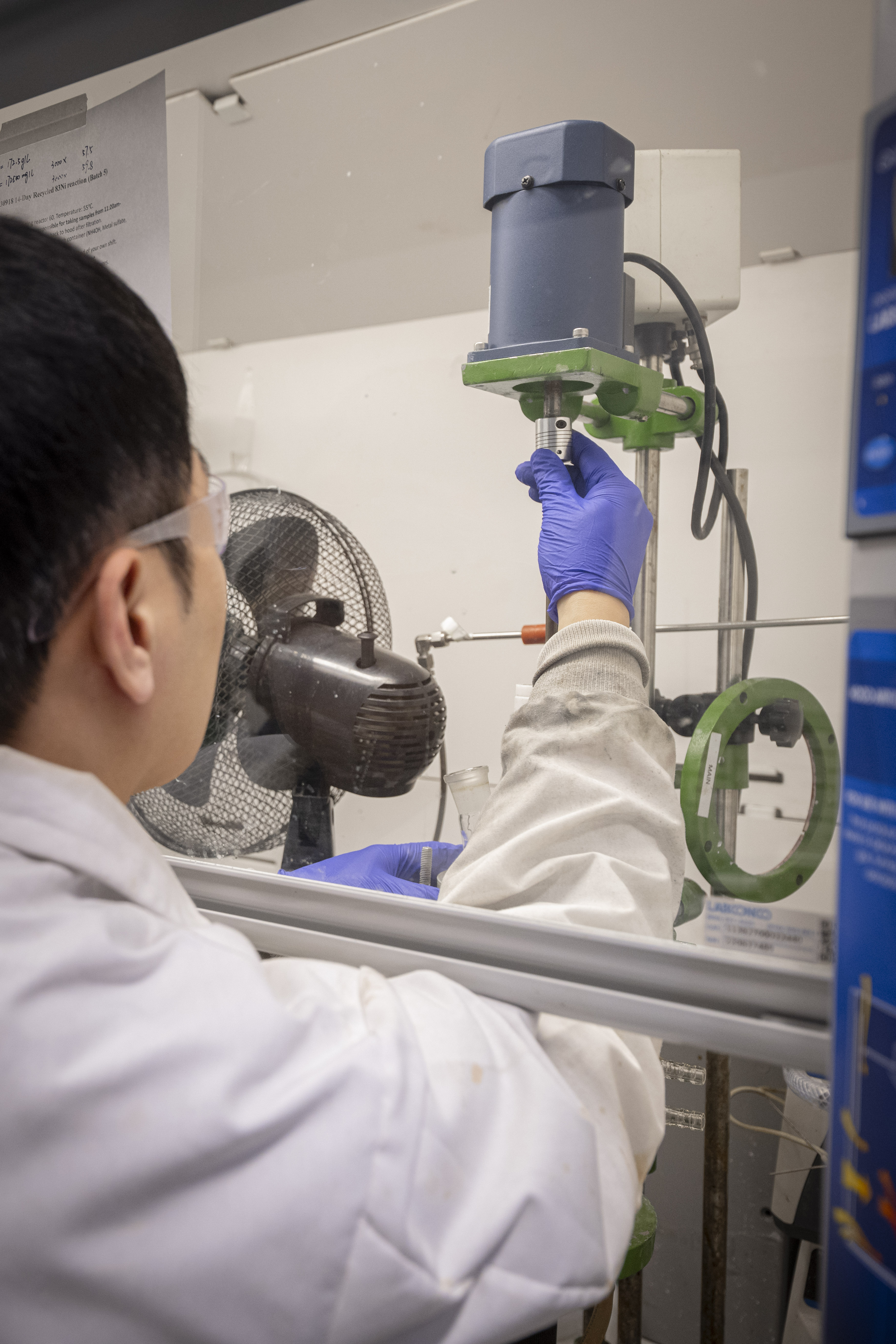 Scientist adjusting an instrument.