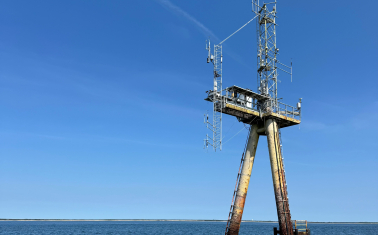 WHOI's Air Sea Interaction Tower, a tall structure in the ocean for offshore research.