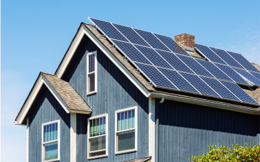 Blue house with a roof solar array
