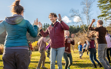 People playing a theater game outdoors