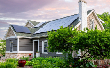 Single family home with solar panels in suburban setting