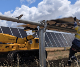 Luminous’ robot, LUMI, working alongside a solar installer on a solar farm
