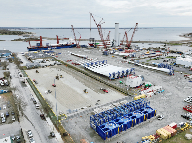 Demolition completed at sites one and two, vehicles park on prepared site.