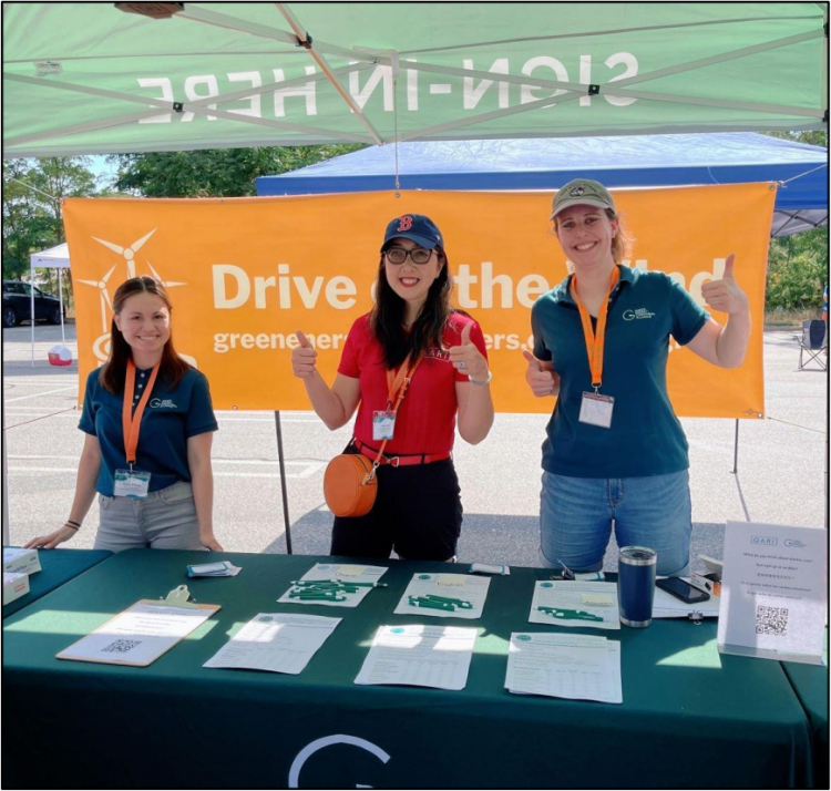 Project partners from Green Energy Consumers Alliance and Quincy Asian Resources, Inc. table at the QARI Drives Green kick-off event