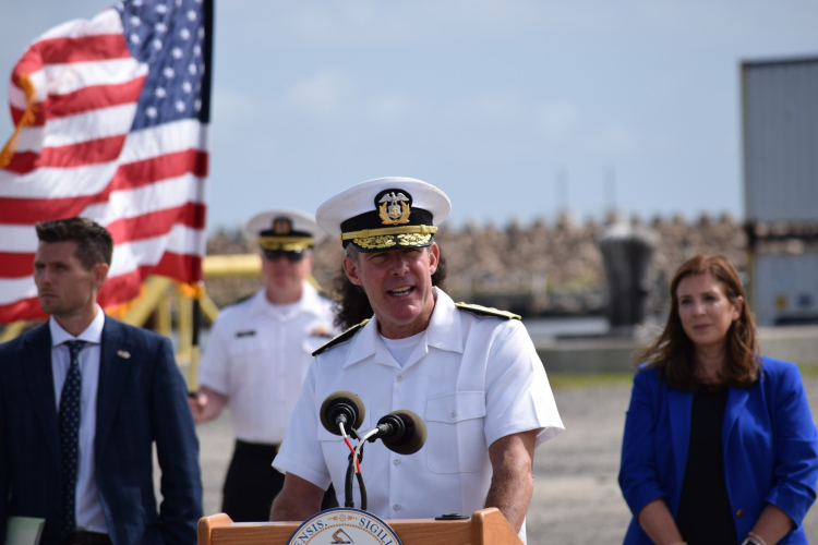 Francis X. McDonald speaking in uniform.