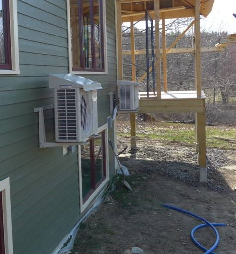 The image above shows a heat pump installed with a drip cap, which is a good way to protect the outdoor unit if it needs to be installed under a roof drip line. (Image from Steven Winters Associates, Inc.)