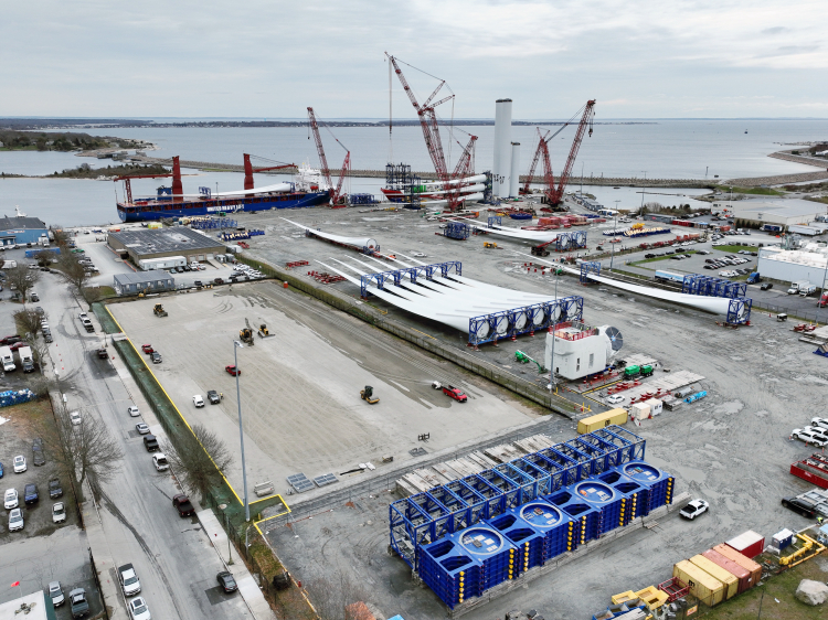 Aerial view of the New Bedford Marine Commerce Terminal serving as a staging and preparation area for construction of the Vineyard Wind 1 offshore wind project.