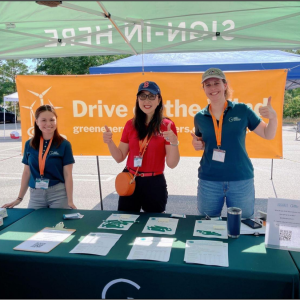 Project partners from Green Energy Consumers Alliance and Quincy Asian Resources, Inc. table at the QARI Drives Green kick-off event