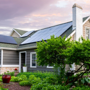 Single family home with solar panels in suburban setting