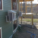 The image above shows a heat pump installed with a drip cap, which is a good way to protect the outdoor unit if it needs to be installed under a roof drip line. (Image from Steven Winters Associates, Inc.)