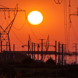Sun over power lines.