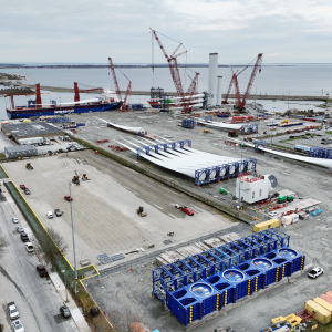 Aerial view of the New Bedford Marine Commerce Terminal serving as a staging and preparation area for construction of the Vineyard Wind 1 offshore wind project.