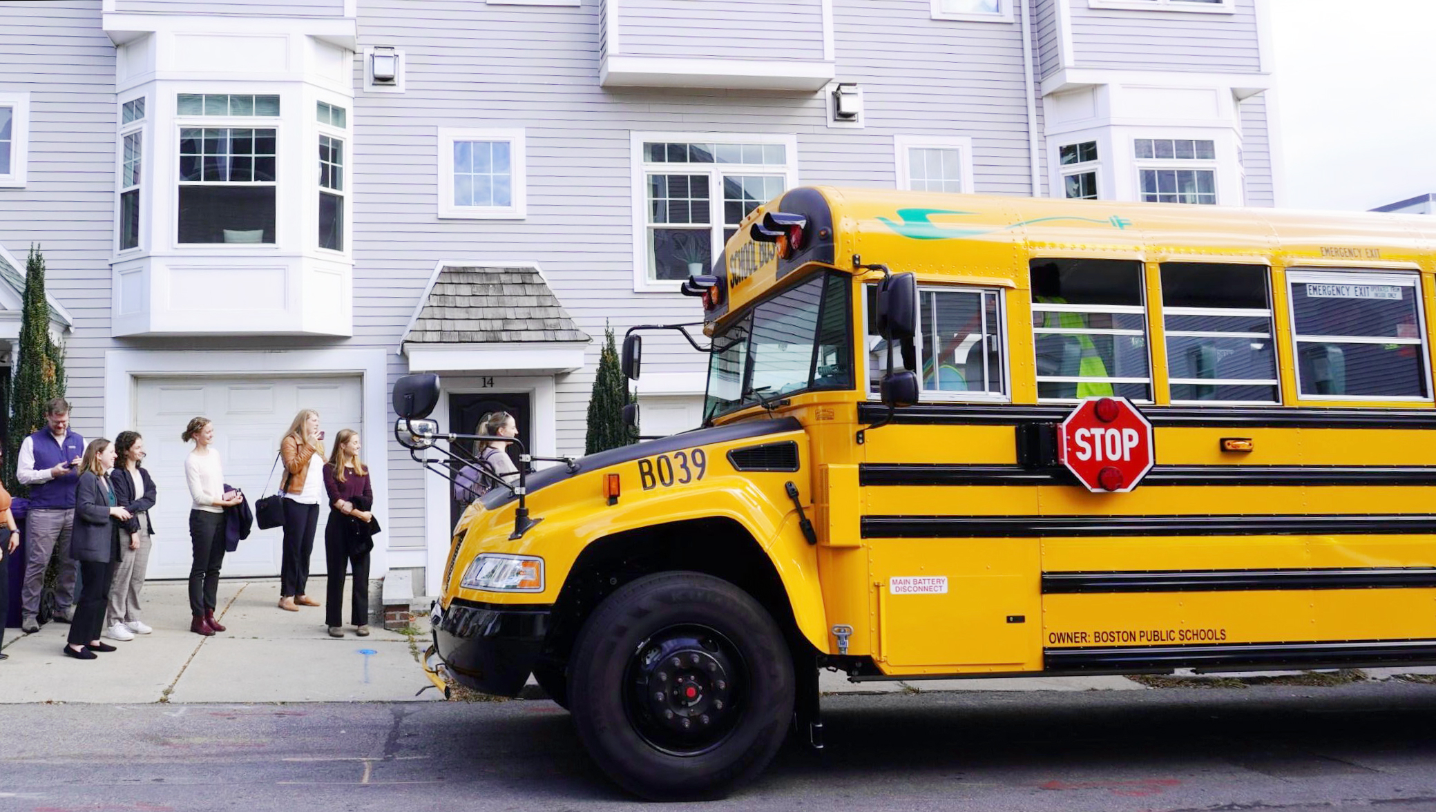 MassCEC visits Boston Public School's Bus yard on an electric school bus.