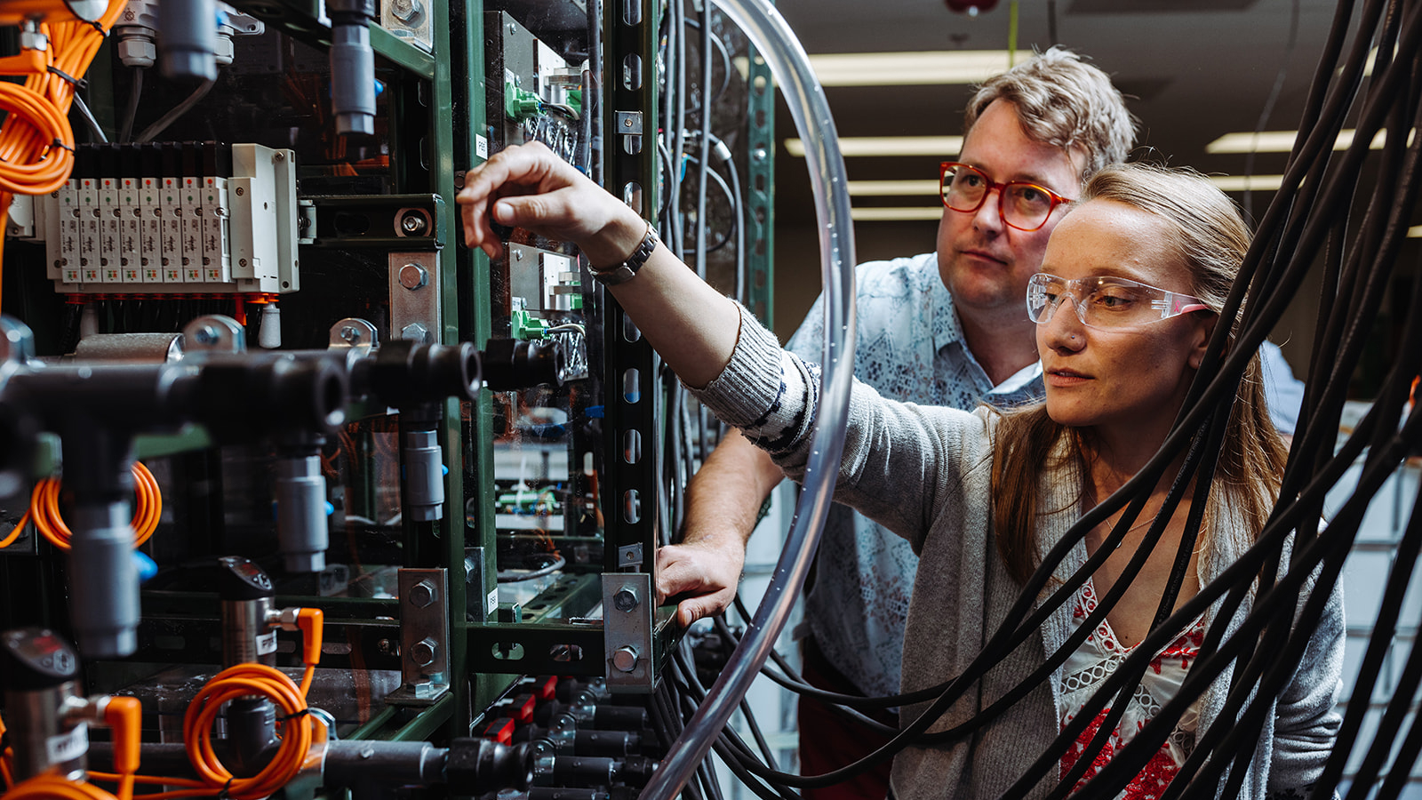 Two engineers working with equipment