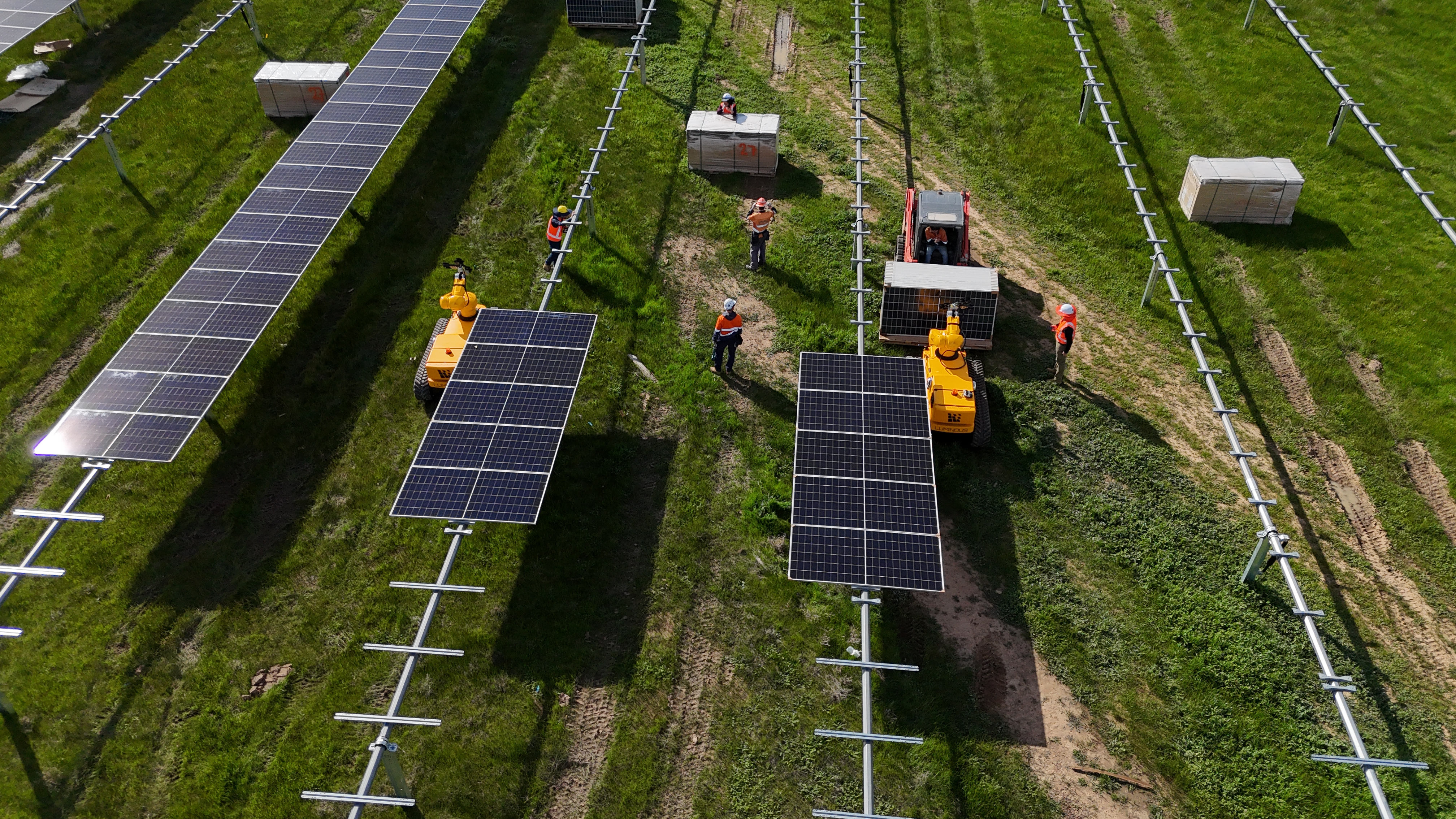 The Luminous crew installing solar panels on a solar farm
