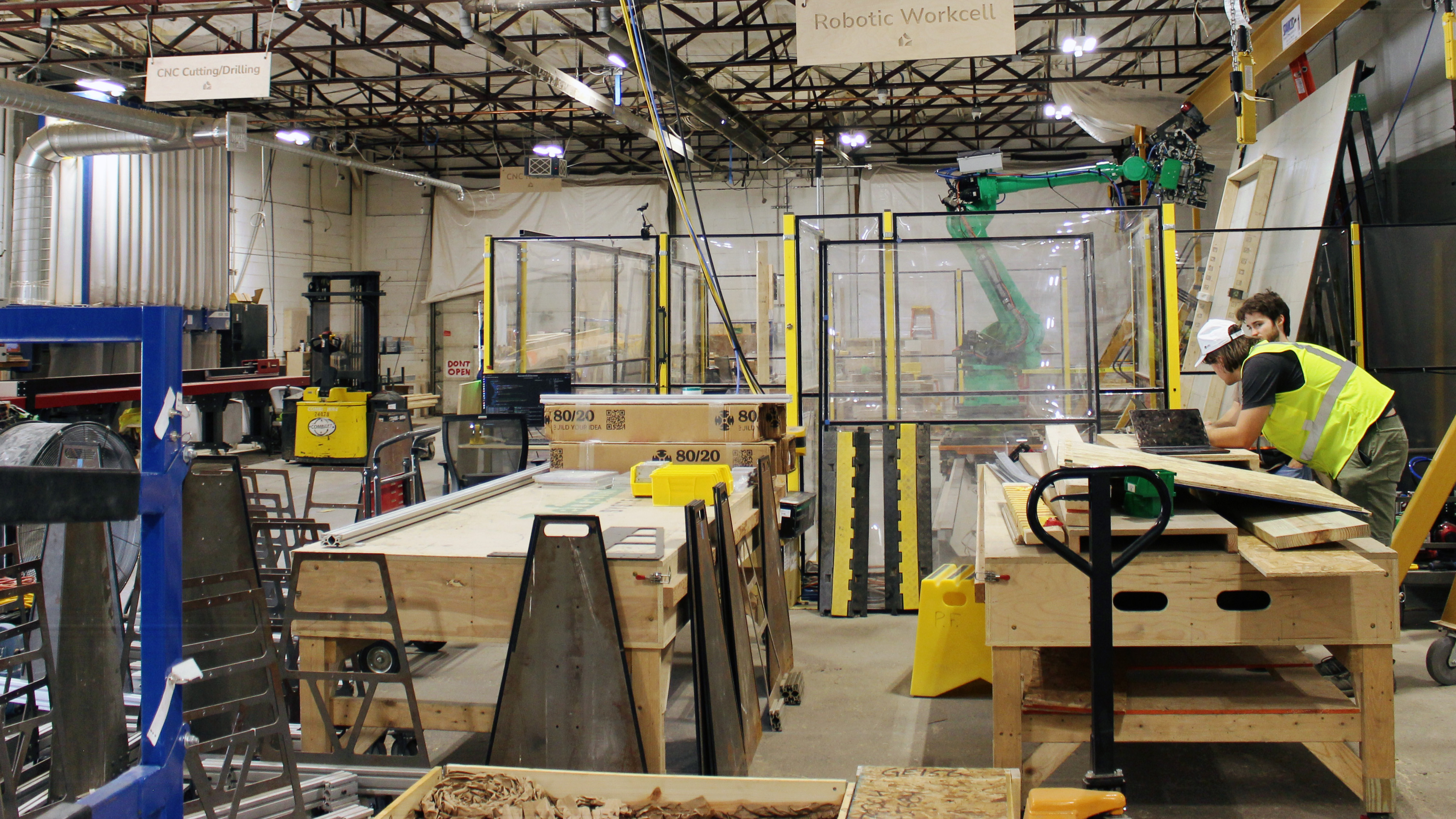 Industrial manufacturing facility with robotic workcells, fabrication equipment, and prototype assembly areas used to develop and scale climatetech technologies.
