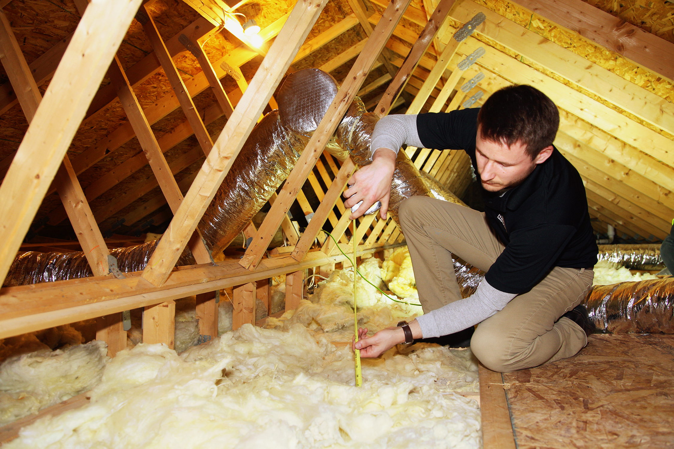 Attic insulation and air sealing work to improve home energy efficiency.