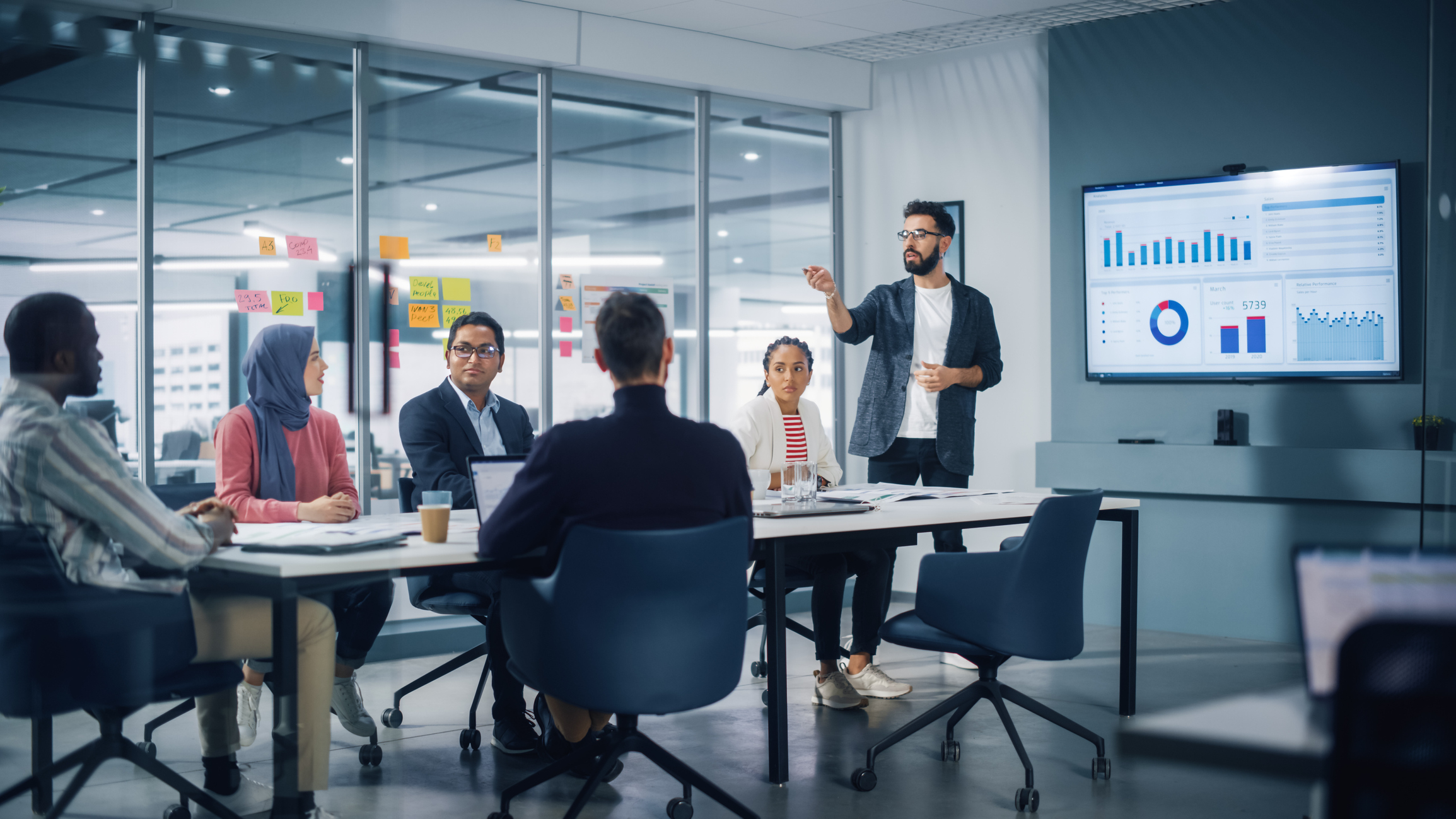 Diverse Modern Office: Businessman Leads Business Meeting with Managers