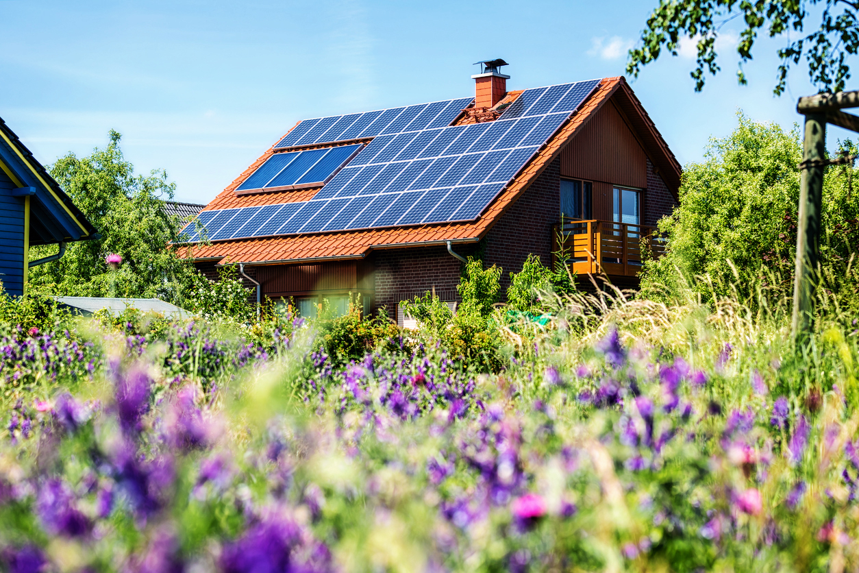 Residential home with rooftop solar panels generating clean energy and reducing electricity costs